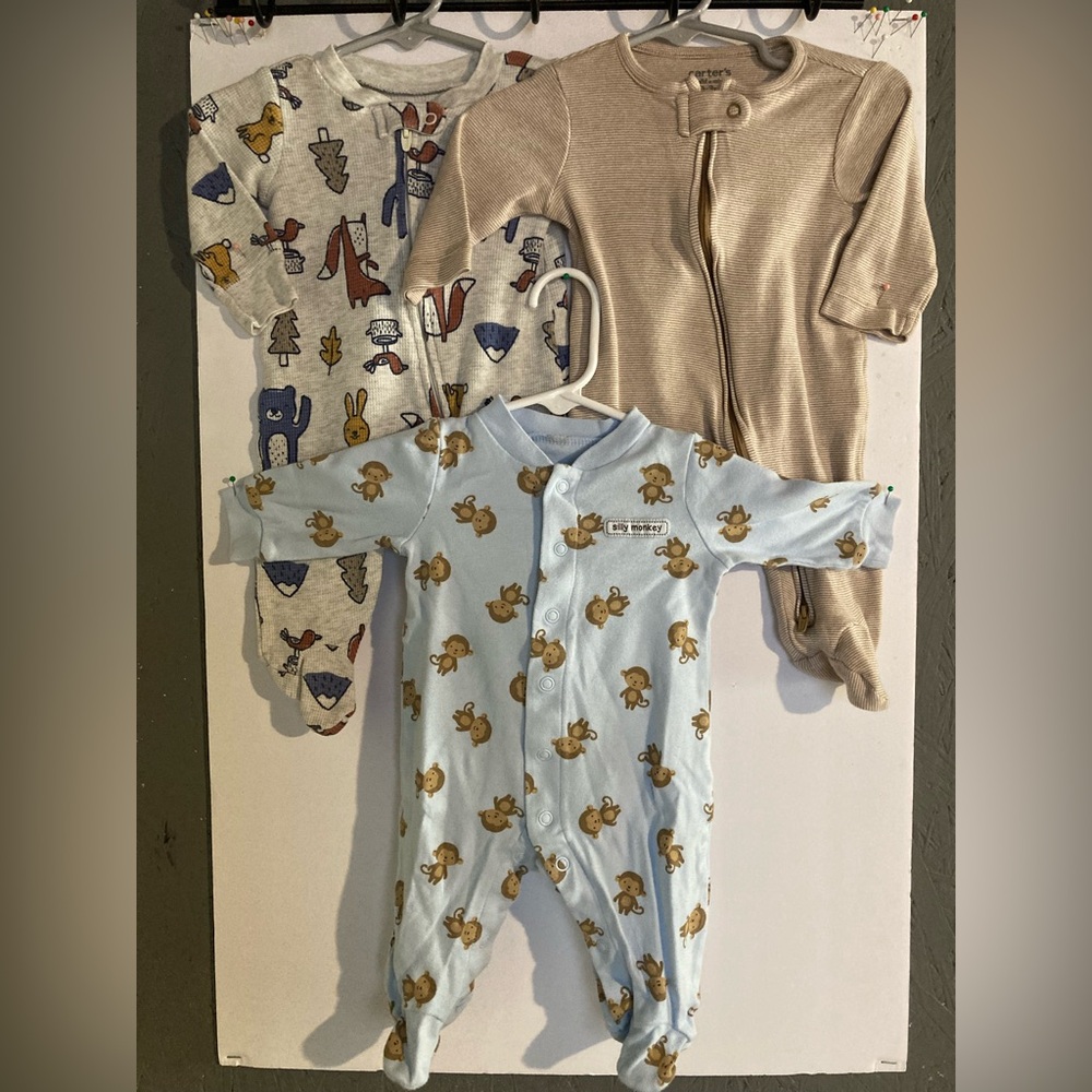 Multiple Carter’s Brand footed Jammie’s 0-3 months
